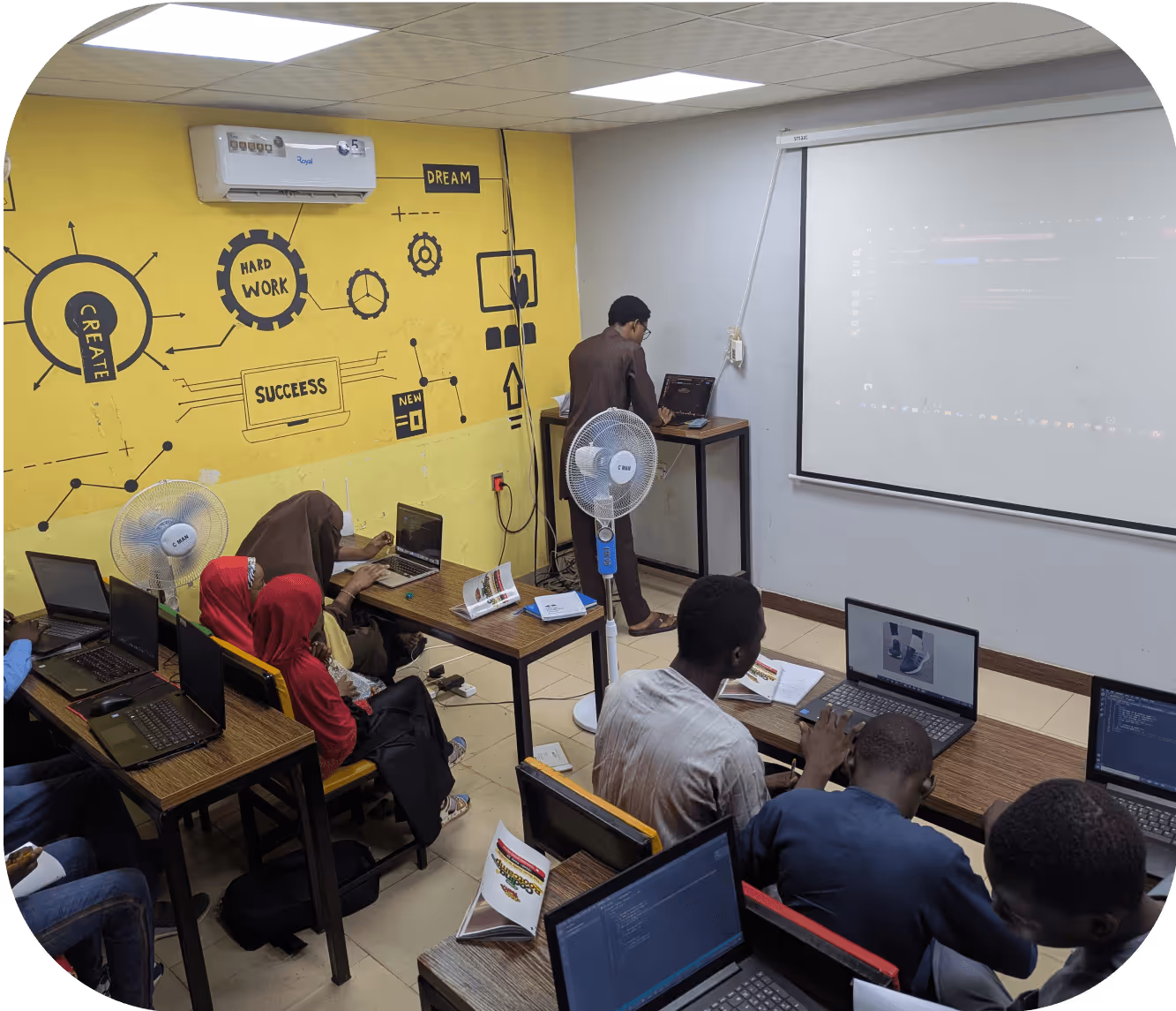 Children collaborating on digital design and creative technology projects